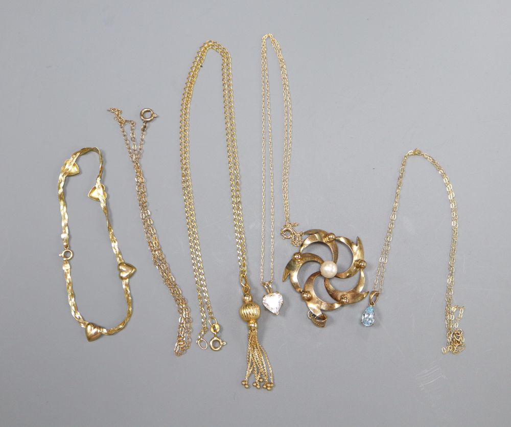 A 9ct gold and pearl openwork flower pendant, a 9ct tassel pendant on chain and three other items,